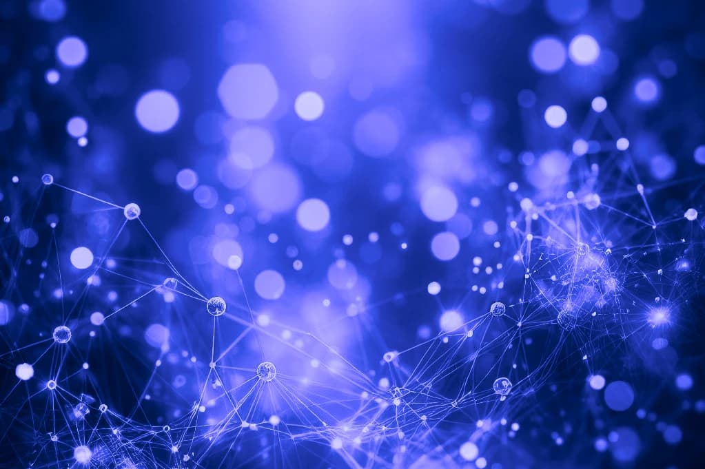 Abstract blue and violet image of glowing nodes connected by thin lines in a network mesh, with soft out-of-focus lights